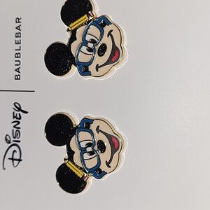 Mickey Mouse with glasses and pencil